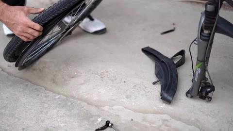 Replacing the camera at the bicycle wheel Stock Footage 129515302