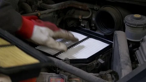 Replacing car air filter Stock Footage 81097783