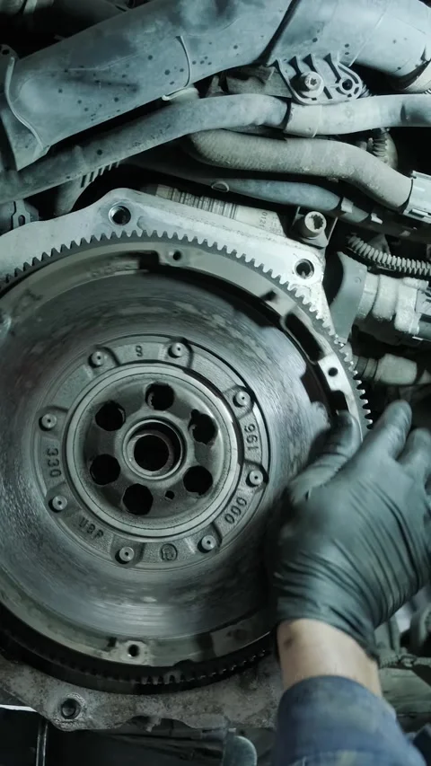 Replacing car clutch system and pressure plate in automotive workshop Stock Footage 332858584