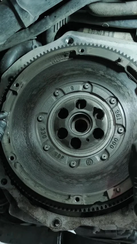 Replacing car clutch system and pressure plate in automotive workshop Stock Footage 332858594