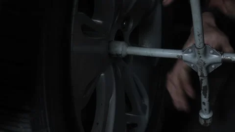 Replacing a car wheel close-up. Slow motion. Stock Footage 274474142