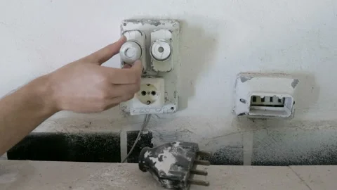 Replacing ceramic fuses on old electrical switchboard Stock Footage 100446753