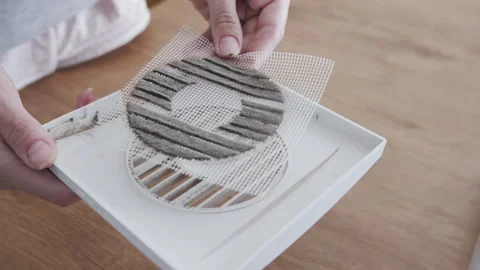 Replacing Clogged Dust Filter Mesh on Exhaust Fan During DIY Home Maintenance 動画素材 341397385
