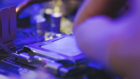 Replacing a computer processor CPU. Installing a computer processor CPU. A Stock Footage 194643859