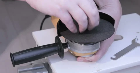 Replacing a disc in an angle grinder Stock Footage 129559639
