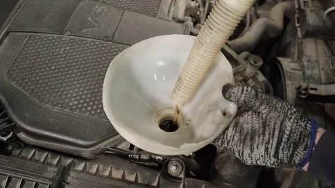 Replacing engine oil car, fuel filters, liquid in plastic funnel Stock Footage 71514512