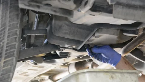 Replacing engine oil in garage Stock Footage 133559298