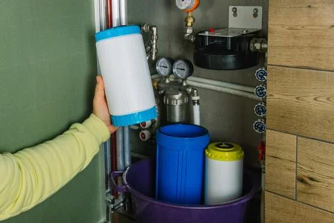 Replacing the filter element in the home water purification system close-up Stock Photos