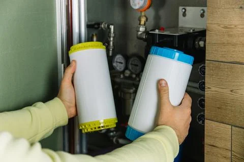 Replacing the filter element in the home water purification system close-up Stock Photos