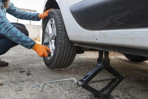 Replacing flat tyre. Stock Photos