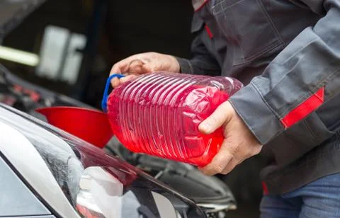The Replacing fluids in a car mechanic 스톡 사진