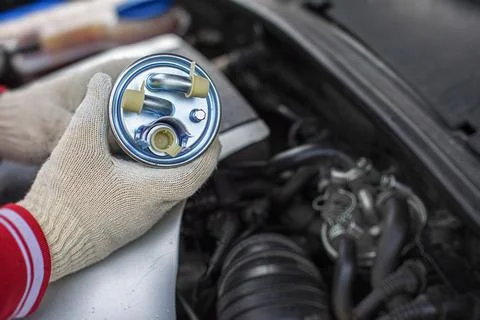 Replacing the fuel filter of car. 스톡 사진