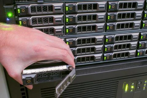 Replacing the hard drive on computer hardware. There are many disk drives in  库存照片