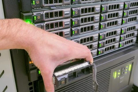 Replacing the hard drive on computer hardware. There are many disk drives in  库存照片