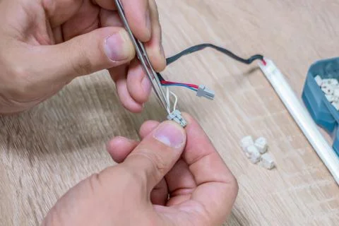 Replacing high voltage lamp of backlight lcd monitor Stock Photos