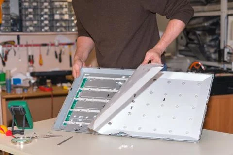 Replacing LED backlight on modern LCD TV Stock Photos
