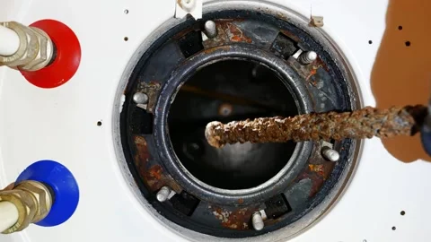 Replacing the magnesium anode in the water heating tank Stock Footage 305674827