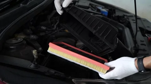 Replacing a new air filter in a passenger car,Automotive part concept. Stock Footage 282230057