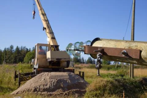 Replacing old power line support Stock-Fotos