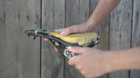 Replacing the old saddle of bicycle Stock Footage 311588598