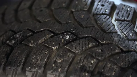 Replacing old worn-out tire spikes process Stock Footage 167488842