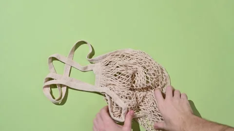 Replacing the plastic bag with an eco-friendly fabric bag. Stock Footage 223705764
