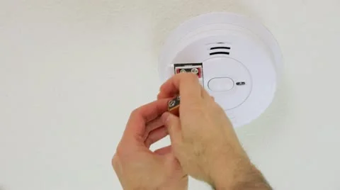 Replacing smoke alarm battery (closeup) Stock Footage 21533481