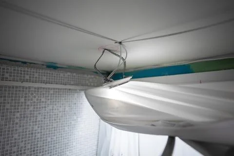 Replacing the stretch ceiling in the bathroom. Stock Photos