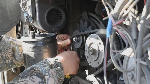 Replacing the timing belt on the engine in daylight Stock Footage 109620725
