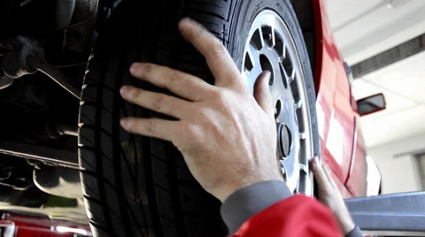 Replacing a tire Stock Footage 32116588