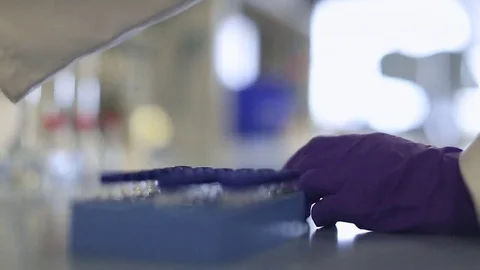 Replacing Vial into Block and Stopper on Flask Stock Footage 69088026