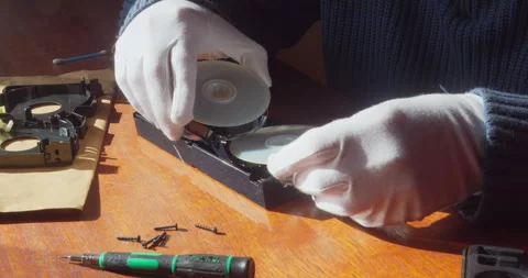 Replacing Video Tape Spools in Retro VHS Cassette Specialist 4K Stock Footage 332141371