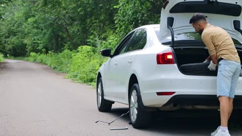 Replacing the wheel on the car. Stock Footage 246693397