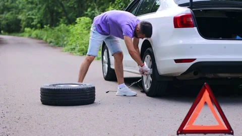 Replacing the wheel on the car. Stock Footage 246694145