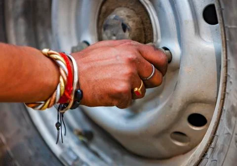 Replacing the wheels of the car on the road Stock Photos