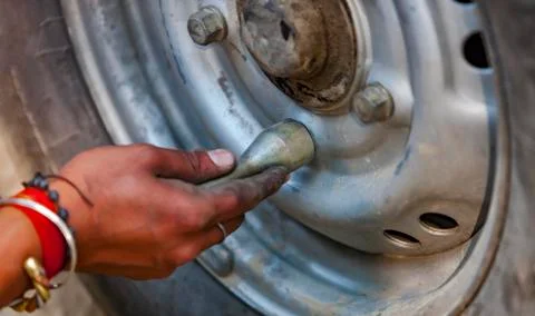 Replacing the wheels of the car on the road Stock Photos