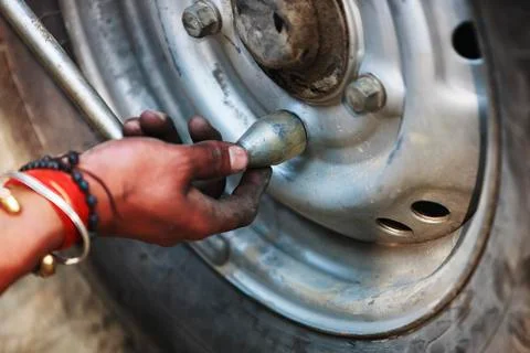 Replacing the wheels of the car on the road Stock Photos
