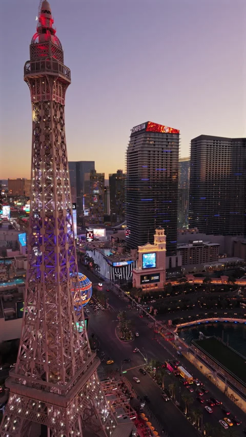 Replica soars over cityscape, Elevated Eiffel replica with scenic lake and Stock Footage 321274219