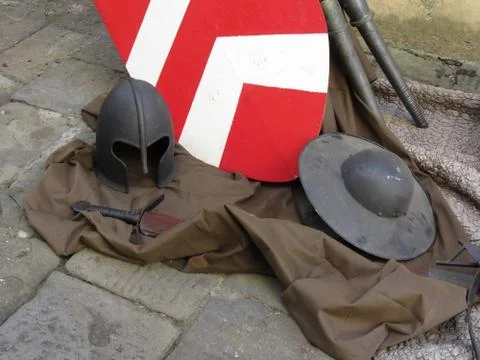 Replicas of medieval helmets, shields and swords Stock Photos