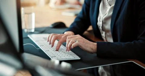 Report, computer and hands in office with keyboard, research and budget rev.. Stock Photos