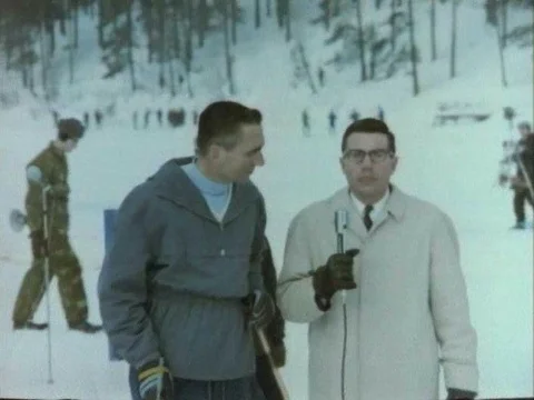 A reporter interrogates an athlete on a ski platform in Finland in the 1970s. Stock Footage 75763064