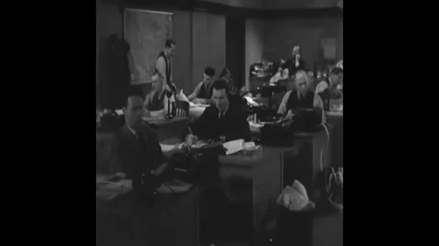 Reporters talk to people over the phone and one reporter tells his boss about a Stock Footage