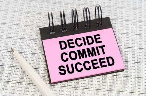 On reporting documents and charts there is a pen and a notepad with the inscr Stock Photos