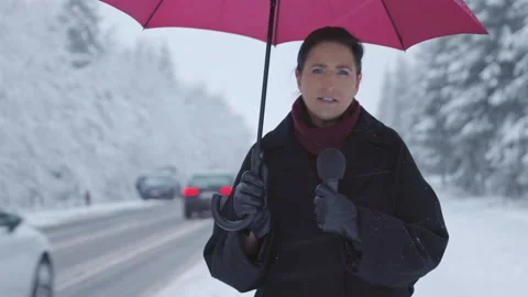 Reporting on Winter Road Conditions Stock-Footage 214045816