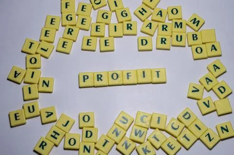 Representation of few letter blocks in which profit is highlighted Stock Photos