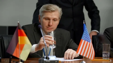 Representative of United States delegation get nervous at international summit Stock Footage 72707215
