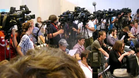 Representatives of press navigate out press conference Stock Footage 12047418