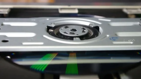 Reproduction of DVD of a disk in the disk drive (close up) Video stock 81139045