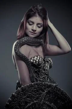 Reptile, brunette woman posing with a python snake australian Stock Photos