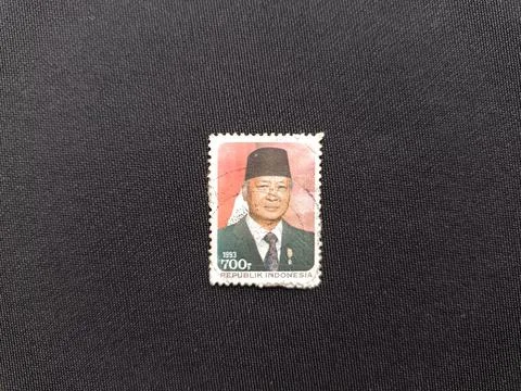 Republic of Indonesia postage stamp depicting President Soeharto. Circa 1993. Stock Photos